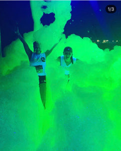 UV Glow Foam pouring over two kids