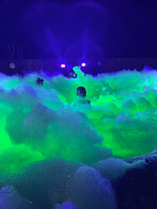 1 Kid barely visible inside glow foam